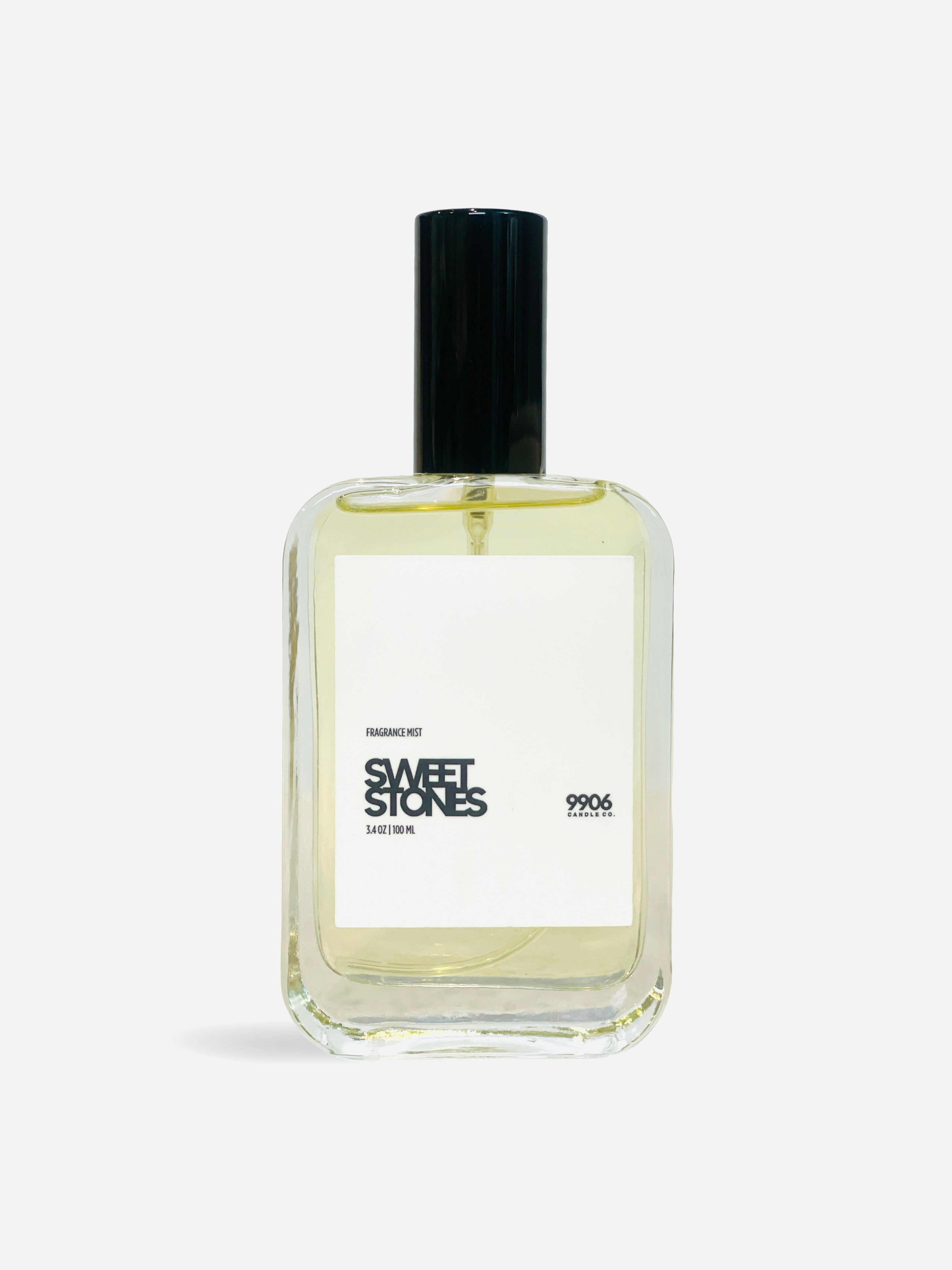 Decadent Escape Fine Mist in luxury glass atomizer with notes of cranberry, praline, and champagne.